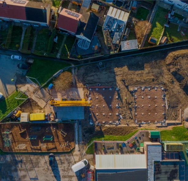 Birds eye view looking down at a construction site for a modular building in school